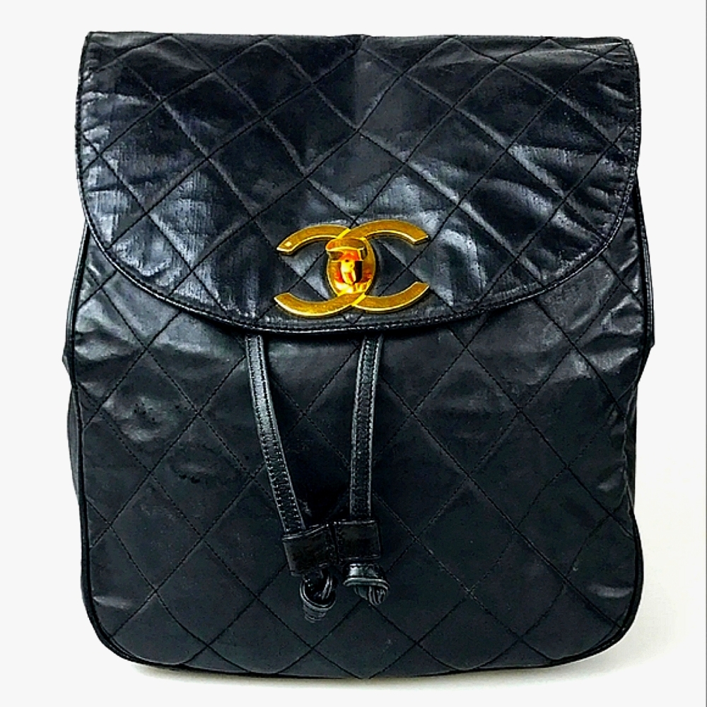 CHANEL Black Quilted Backpack with Gold Accents